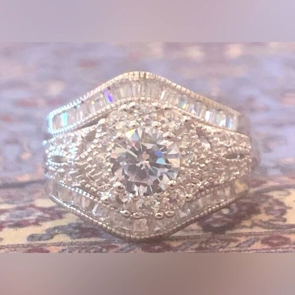 Jewelry - Breathtaking ring with guard, Brilliant cut center  stone w/ rounds . Size 9